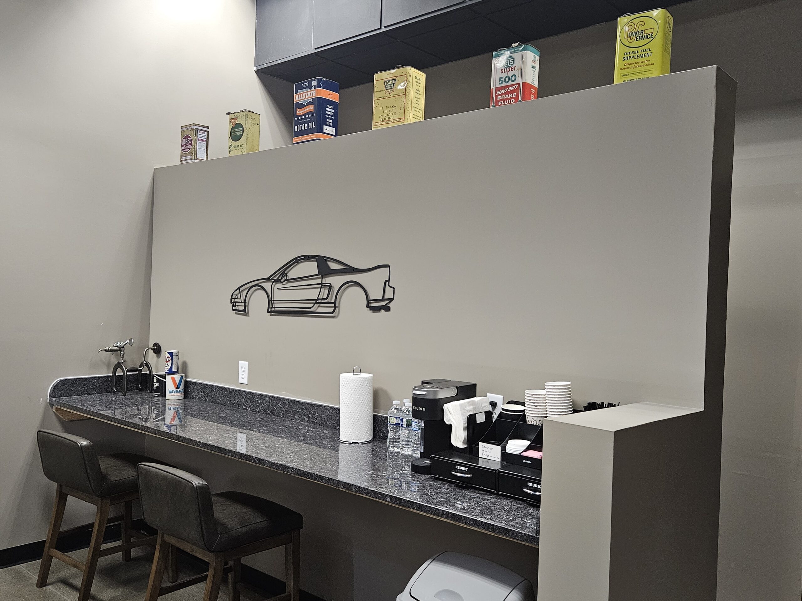 Cafe & coffee bar waiting area at Exclusive Repair West.